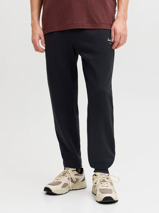 Ανδρικό παντελόνι φόρμας JPSTGORDON ARCHIVE SWEAT PANTS JACK&JONES 12288641 BLACK NOOS W26/27